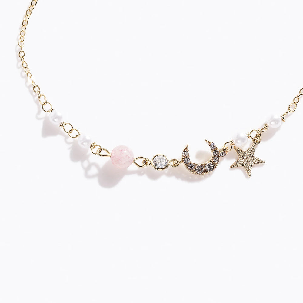 Gold Tone Star & Moon Bracelet