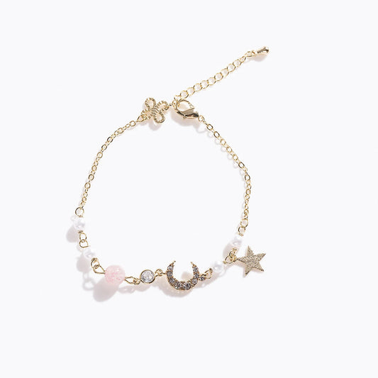 Gold Tone Star & Moon Bracelet